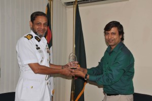 G.M. Mamunur Rashid is presenting a FIMA crest to Naval Commodore, Commanding Khulna.